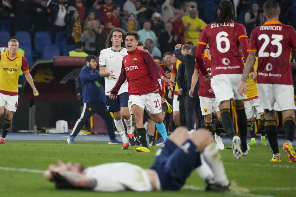 Roma's Paulo Dybala, center, celebrates at the end of a Serie A soccer match between Roma and Lazio, at Stadio Olimpico, in Rome, Italy, Saturday, April 6, 2024. (AP Photo/Gregorio Borgia)