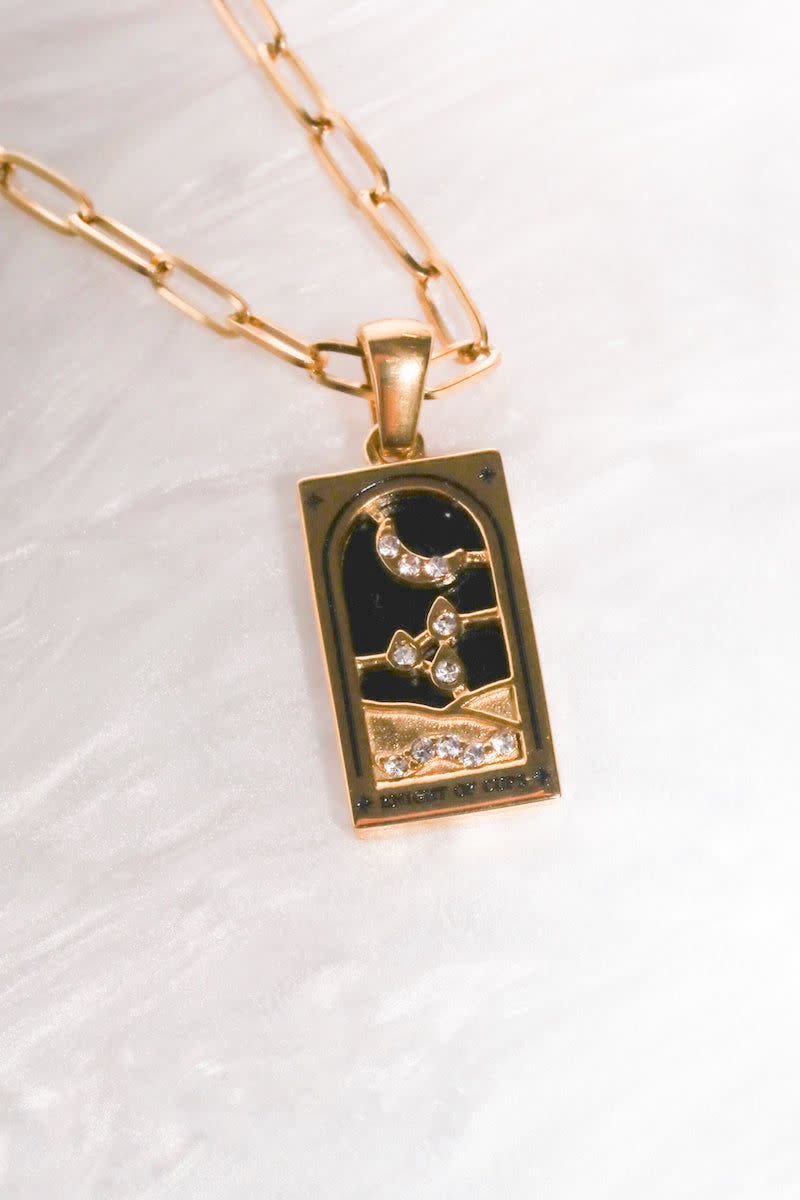 <p><a href="https://go.redirectingat.com?id=74968X1596630&url=https%3A%2F%2Fmureandgrand.com%2Fproducts%2Fthe-knight-of-cups-tarot-card-pendant-necklace&sref=https%3A%2F%2F" rel="nofollow noopener" target="_blank" data-ylk="slk:Shop Now;elm:context_link;itc:0;sec:content-canvas" class="link ">Shop Now</a></p><p>The Knight of Cups Tarot Card Pendant Necklace</p><p>mureandgrand.com</p><p>$29.00</p>