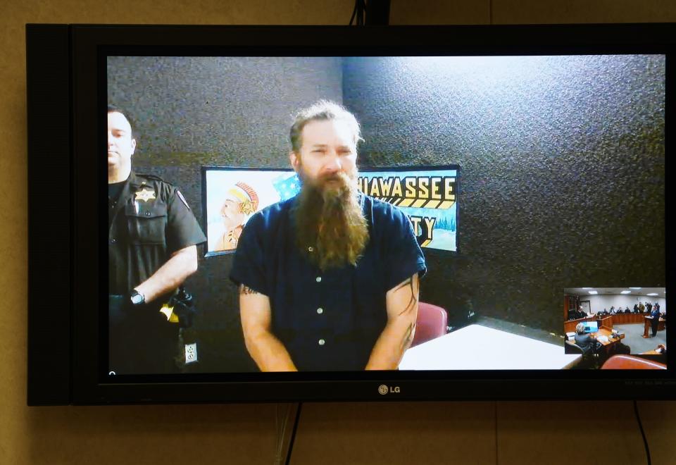 Mark Latunski makes a video appearance at the 66th District Court in Corunna on  Jan. 8 for his probable cause hearing. Latunski is accused of killing and eating parts of his Grindr date, Kevin Bacon of Swartz Creek, at Latunski’s home in Bennington Township, Michigan.