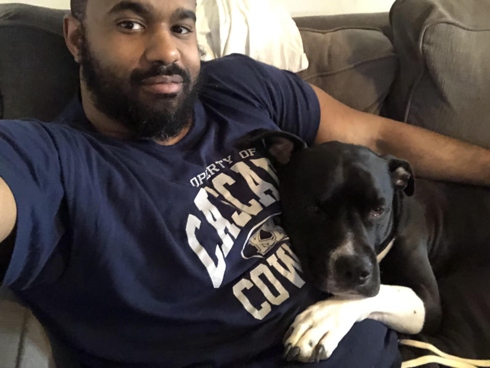 Michael Tyler, a campaign staffer for Cory Booker, poses with his dog Gumbo. (Credit: Michael Tyler)