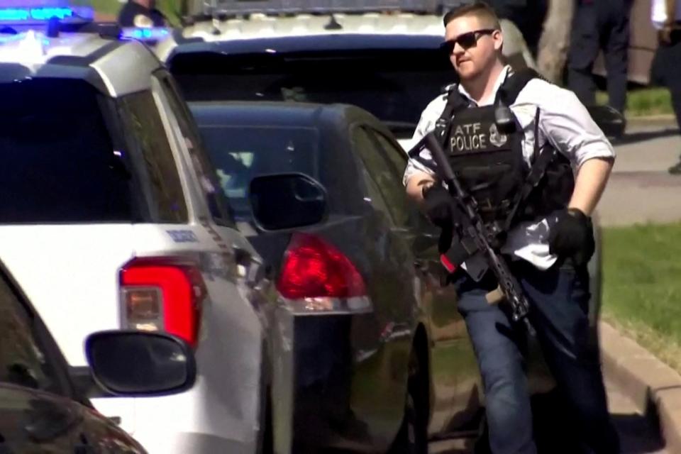 A law enforcement officer runs near the Covenant School after a shooting in Nashville, Tennessee, U.S. March 27, 2023 (via REUTERS)