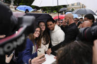 Rafael Nadal takes selfies with supporters during an event at Rome's Piazza Del Popolo, Wednesday, May 8, 2024. The 37-year-old Nadal, who has indicated that this will be his final year on tour, has played only nine matches this year after missing nearly all of 2023 due to a hip injury that required surgery. (AP Photo/Alessandra Tarantino)