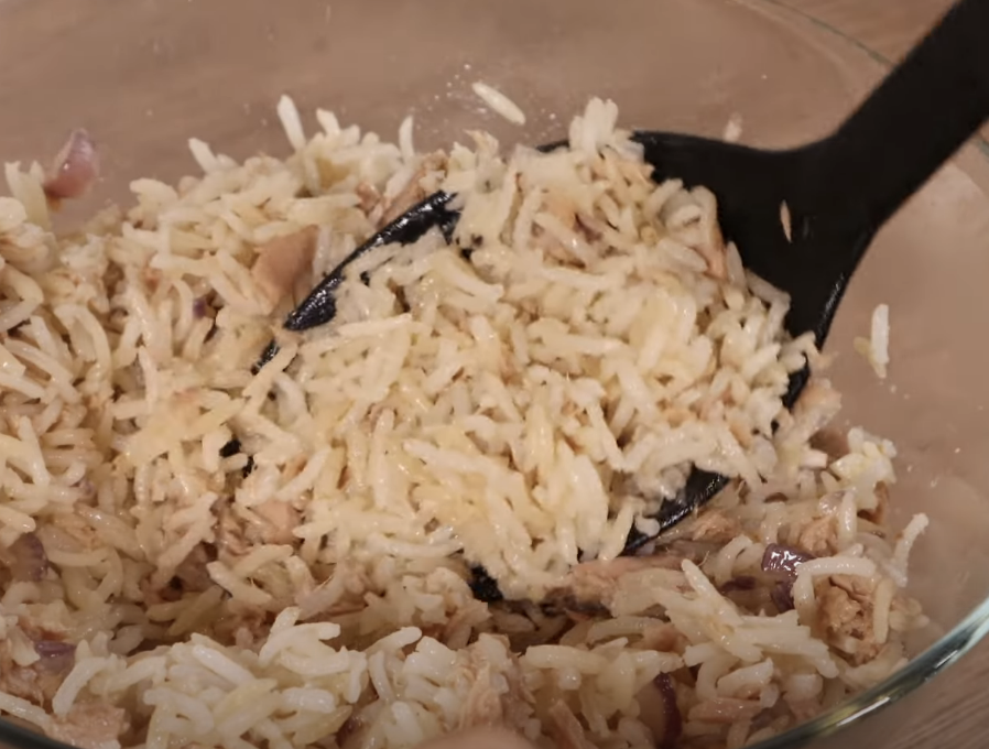 rice and tuna mixed together in a bowl