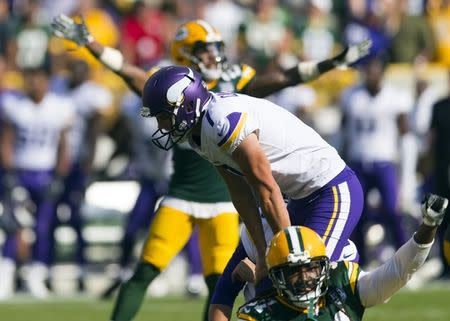 Sep 16, 2018; Green Bay, WI, USA; Minnesota Vikings kicker Daniel Carlson (7) reacts after missing a game winning field goal as time expires during overtime against the Green Bay Packers at Lambeau Field. Mandatory Credit: Jeff Hanisch-USA TODAY Sports