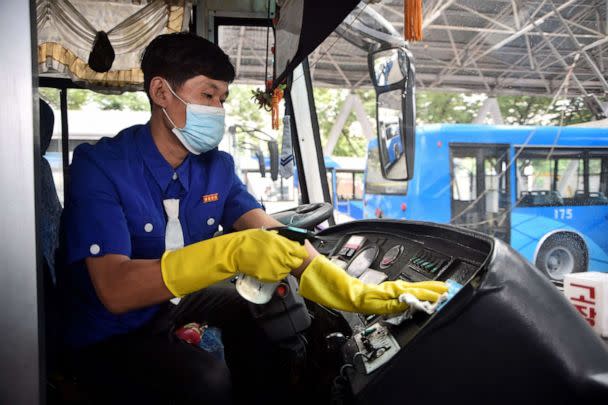 PHOTO: A driver of the Ryonmot Trolley Bus Office disinfects a trolley bus as part of preventative measures against COVID-19 in Pyongyang, on June 9, 2022. (Kim Won Jin/AFP via Getty Images)