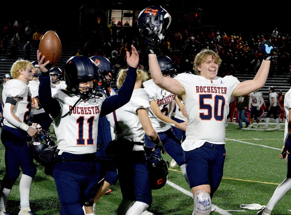 Rochester's Bryan Zulauf, left, and Parker Lyons raise their arms in victory after the Rockets defeated Murphysboro Saturday, Nov. 18, 2023 and will now go on to the state championships next week.