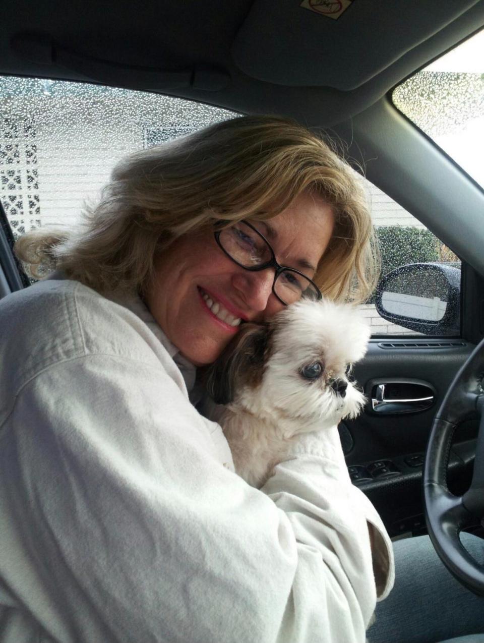 Good Samaritan Sue Harvey, posing here with a furry friend, has been recognized by PETA for rescuing a dog from a hot car in Palm Desert.