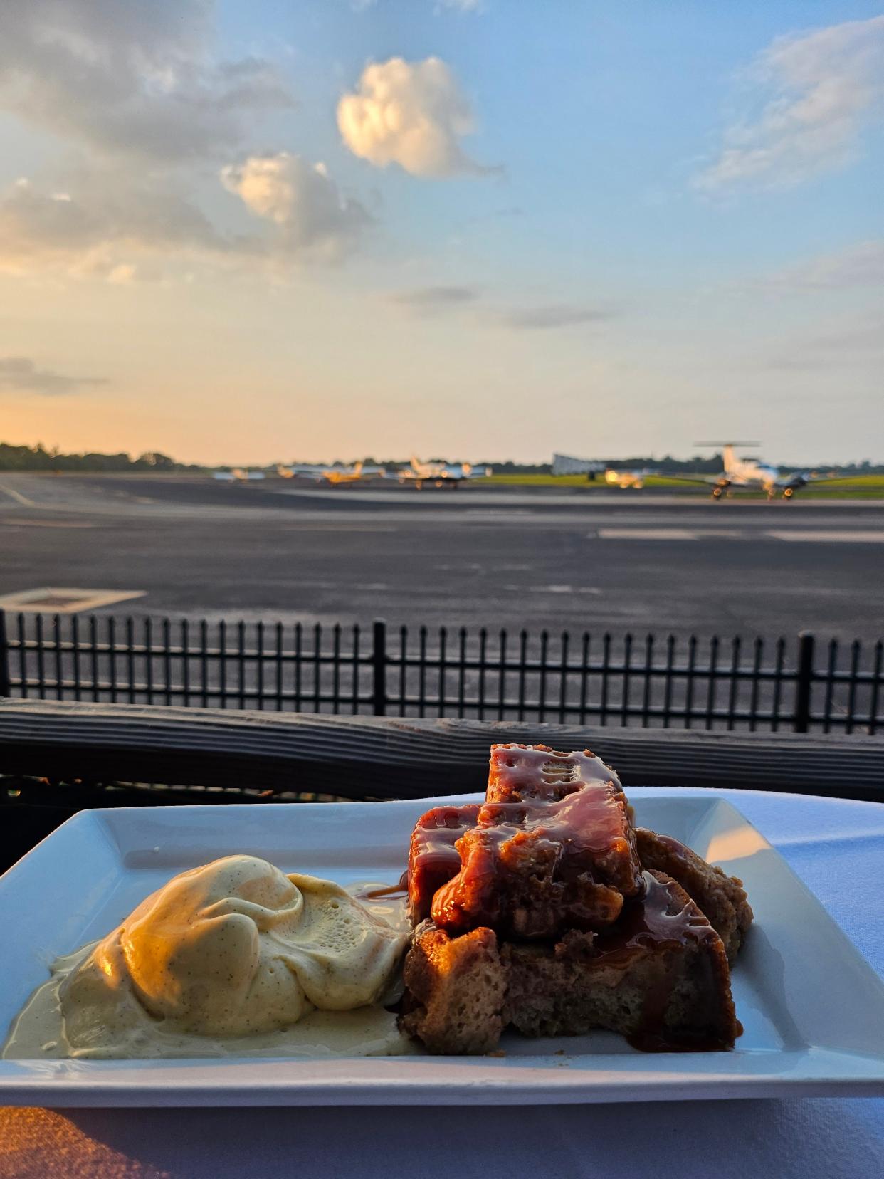 Pain perdu with a view: Parisian-style bread pudding spiked with brandy and topped with warm caramel sauce served a la mode on the back deck at Bistro Le Relais in Louisville.