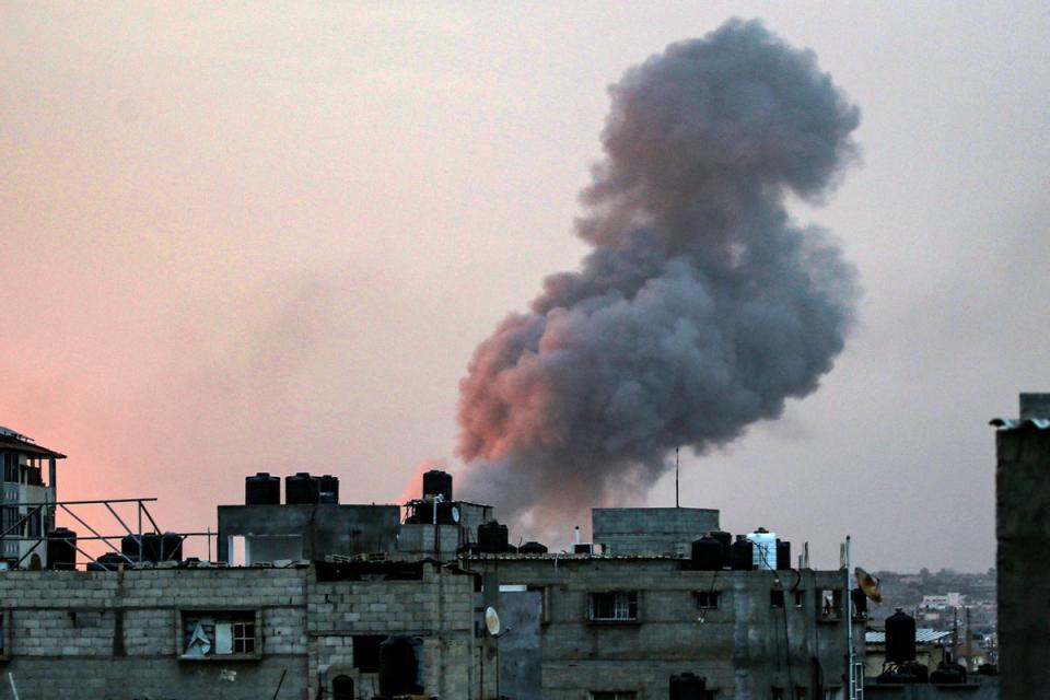 Smoke rises above buildings during an early-morning Israeli strike on Rafah in the southern Gaza Strip on May 11 (AFP via Getty Images)