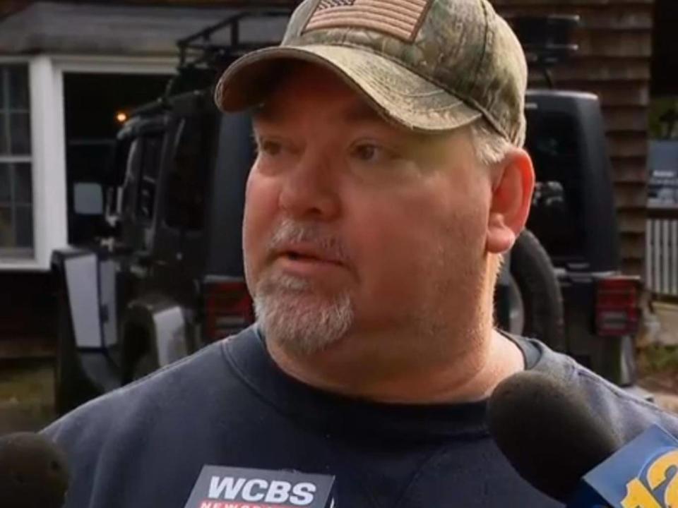 Michael Carroll speaking to reporters outside his home once the DNA match had been made (News 12)