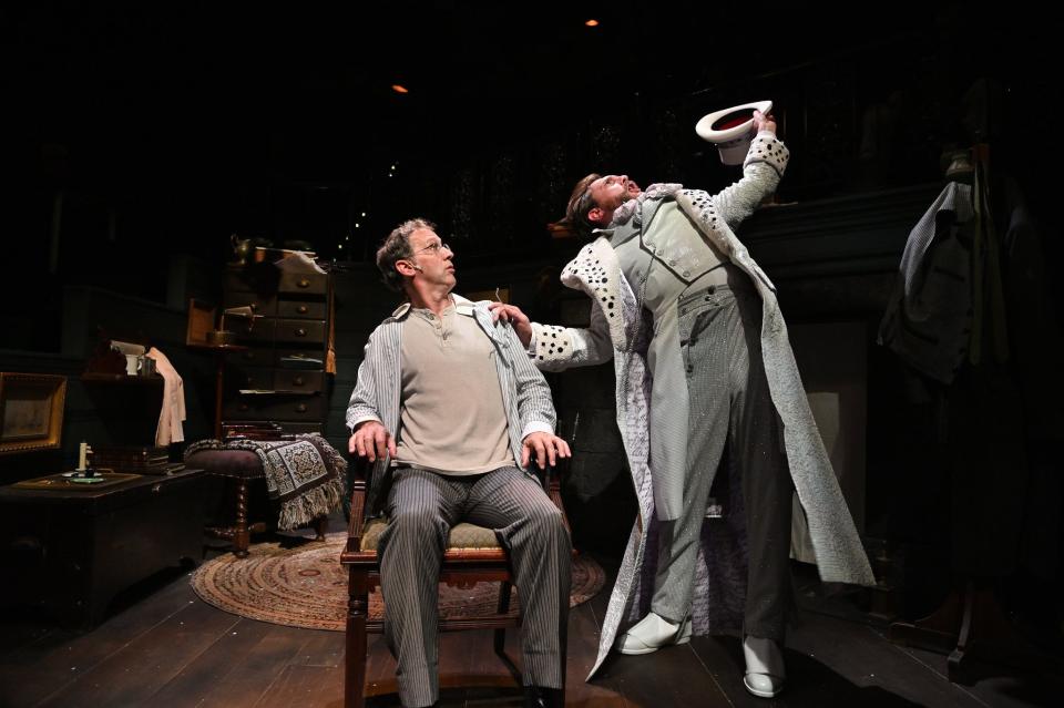 Mauro Hantman as Ebenezer Scrooge and Jeff Church as the Ghost of Christmas Past in the Trinity Repertory Company production of "A Christmas Carol."