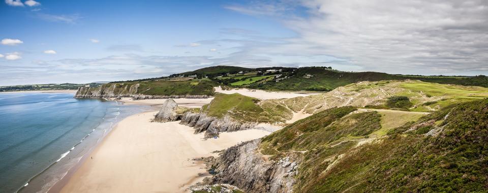 <p>Often voted among the top sands in <a href="https://www.goodhousekeeping.com/uk/lifestyle/travel/a29483104/best-uk-holidays/" rel="nofollow noopener" target="_blank" data-ylk="slk:Britain;elm:context_link;itc:0;sec:content-canvas" class="link ">Britain</a>, Europe and even the world, the best beaches in Wales are worth considering for a coastal <a href="https://www.goodhousekeeping.com/uk/lifestyle/travel/g34842793/staycation-uk/" rel="nofollow noopener" target="_blank" data-ylk="slk:staycation;elm:context_link;itc:0;sec:content-canvas" class="link ">staycation</a> and we've rounded up 23 of the loveliest stretches for you to visit this summer. </p><p>A perfect alternative to the beaches of Cornwall or Norfolk, the best beaches in Wales offer glorious sand, epic scenery and many welcome dogs so you can take the whole gang along.<br></p><p>Of course, you'll want to spend longer than a day trip soaking up the sea views and relaxing in these incredible locations so we've brought you the top holiday cottages to book on or near the beach, too.</p><p>When it comes to the best beaches in Wales, Barafundle, Rhossili and <a href="https://www.airbnb.co.uk/s/Tenby/homes" rel="nofollow noopener" target="_blank" data-ylk="slk:Tenby;elm:context_link;itc:0;sec:content-canvas" class="link ">Tenby</a> are among the most beautiful spots that regular feature in the world's top 20 lists.</p><p>With miles of superb coastline, there are countless sandy stretches to choose from, whether you're after the best beaches in North Wales or the most beautiful strips in the south.</p><p>From Pembrokeshire to Conwy and Gwynedd to Carmarthenshire, here's where to go to experience Wales' best beaches in 2022 and the places to stay nearby with the likes of <a href="https://airbnb.pvxt.net/dogRjQ" rel="nofollow noopener" target="_blank" data-ylk="slk:Airbnb;elm:context_link;itc:0;sec:content-canvas" class="link ">Airbnb</a>, <a href="https://www.vrbo.com/en-gb/holiday-rentals/united-kingdom/wales" rel="nofollow noopener" target="_blank" data-ylk="slk:VRBO;elm:context_link;itc:0;sec:content-canvas" class="link ">VRBO</a> and <a href="https://www.holidaycottages.co.uk/wales" rel="nofollow noopener" target="_blank" data-ylk="slk:Holidaycottages.co.uk;elm:context_link;itc:0;sec:content-canvas" class="link ">Holidaycottages.co.uk</a>.</p>