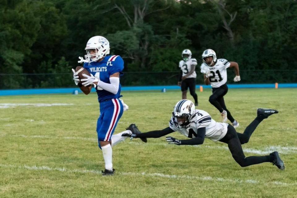 Williamsburg receiver Bryce Lillie hauls in a pass in the second quarter of the Wildcats' 42-14 win over St. Bernard Friday, August 26, 2022