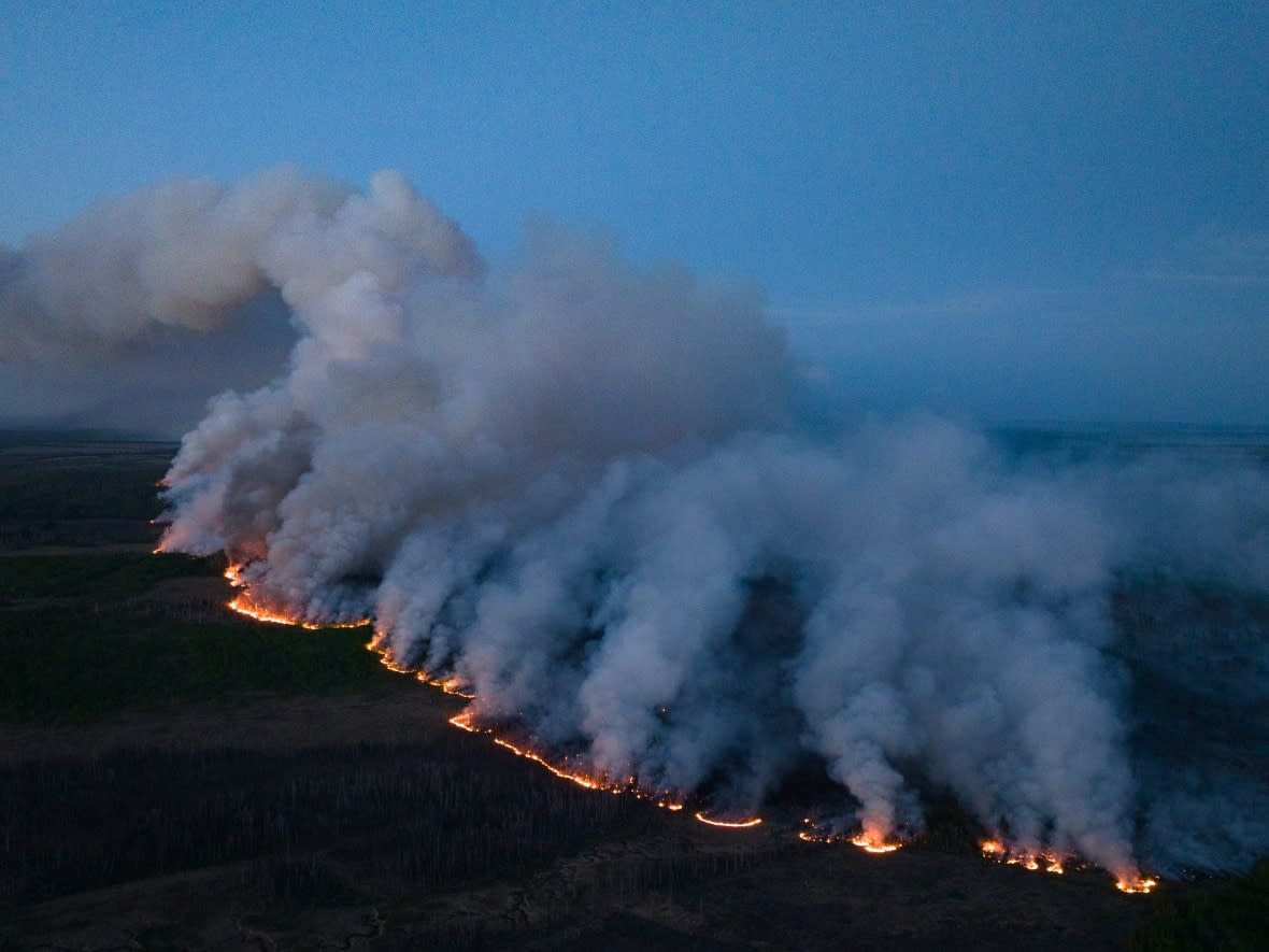 The Stoddart Creek fire northwest of Fort St. John, B.C., is shown May 13, 2023. Researchers with the Northern Tornadoes Project at Western University in London, Ont., are noticing a relationship between the intensity of wildfires and tornadoes.  (B.C. Wildfire Service - image credit)