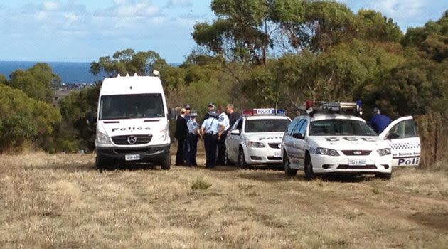 Police and bomb squad technicians near where the explosives were discovered. Photo: Jeff Anderson.