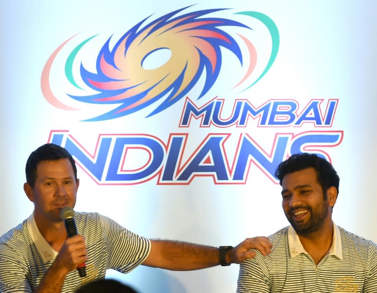 Former Australian cricketer and Mumbai Indians coach Ricky Ponting (L) speaks at a press conference next to captain Rohit Sharma, ahead of the Indian Premier League (IPL) tournament, in Mumbai, on April 7, 2016