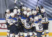 St. Louis Blues celebrate a goal during against the Vancouver Canucks during overtime in Game 3 of an NHL hockey first-round playoff series, Sunday, Aug. 16, 2020, in Edmonton, Alberta. (Jason Franson/The Canadian Press via AP)