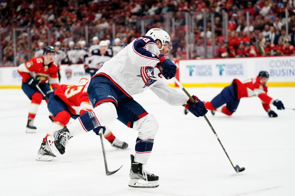 Columbus Blue Jackets center Boone Jenner shoots and scores during the first period of an NHL hockey game against the Florida Panthers, Monday, Nov. 6, 2023, in Sunrise, Fla. (AP Photo/Wilfredo Lee)