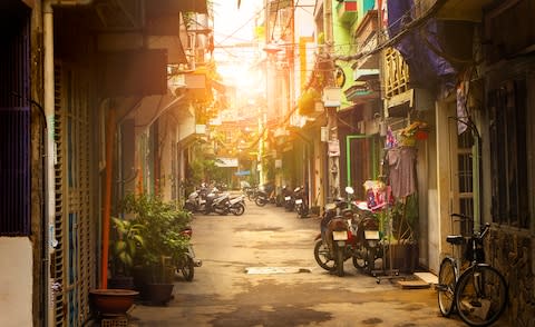 A quiet street in Ho Chi Minh City - Credit: GETTY