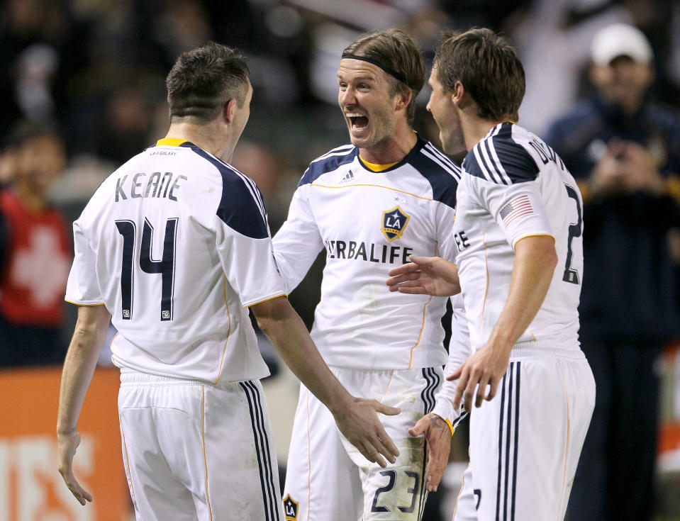 CARSON, CA - NOVEMBER 06: Robbie Keane #14 of the Los Angeles Galaxy celebrates with David Beckham #23 and Todd Dunivant #2 after Keane scored the Galaxy's third goal against Real Salt Lake in the MLS Western Conference Championship at The Home Depot Center on November 6, 2011 in Carson, California. The Galaxy won 3-1 to advance to the MLS Cup. (Photo by Stephen Dunn/Getty Images)