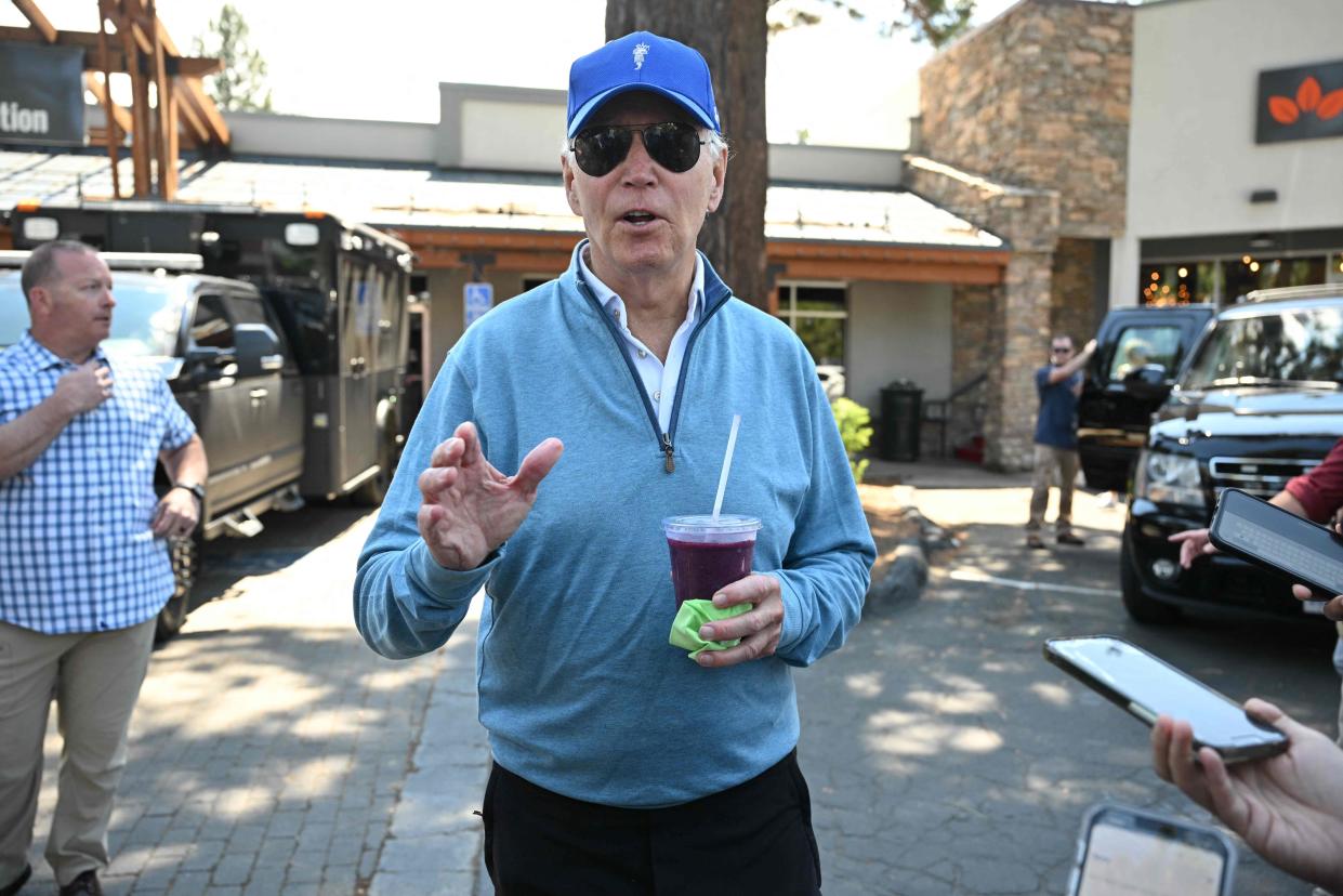 President Joe Biden speaks to reporters after taking a pilates class followed by a spin class with First Lady Jill Biden and members of their family in South Lake Tahoe, California on 23 August 2023 (AFP via Getty Images)