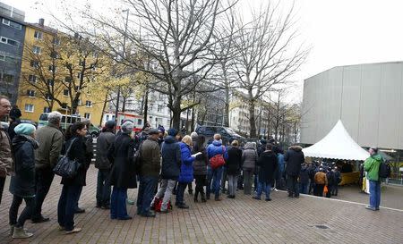 The general public and media queue outside the Higher Regional Court in Munich, Germany, December 9, 2015, prior to the continuation of the trial against Beate Zschaepe. REUTERS/Michael Dalder