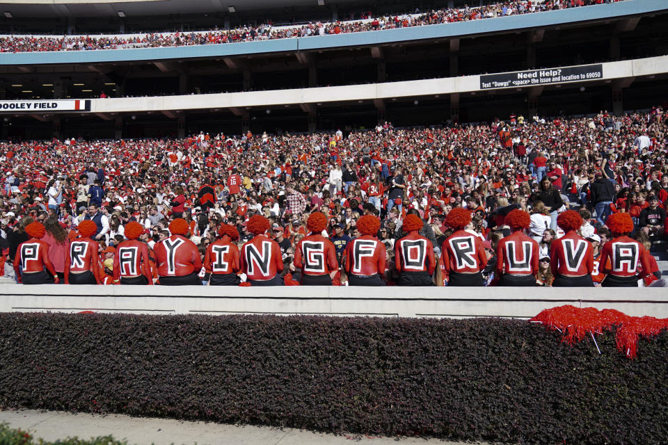 Georgia fans show their support for the victims of a mass shooting at the University of Virginia during the first half of an NCAA college football game between Georgia and Georgia Tech Saturday, Nov. 26, 2022 in Athens, Ga. (AP Photo/John Bazemore)