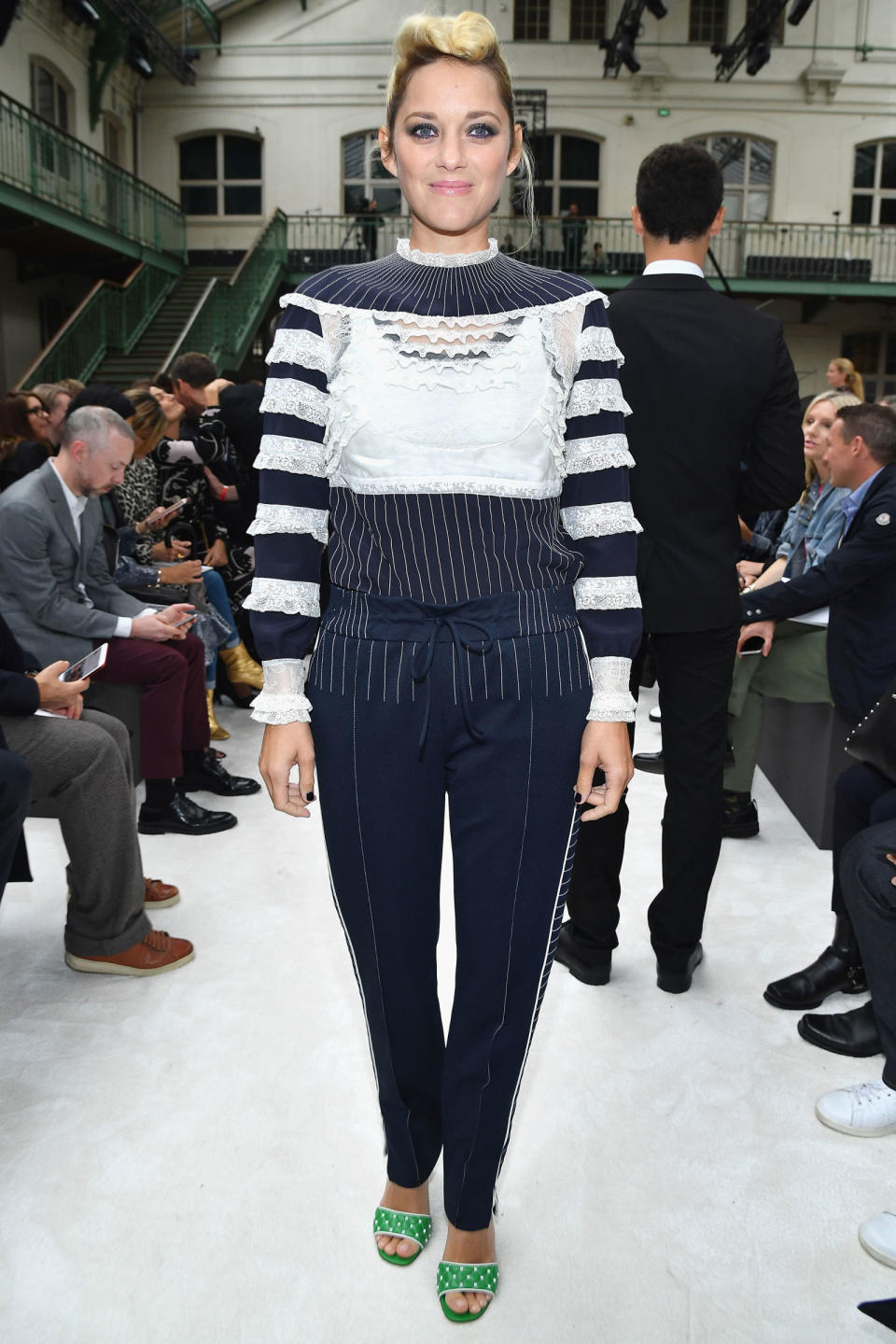 <p><strong>1 October</strong> Marion Cotillard debuted her new blonde hair colour on the front row wearing navy trousers with a co-ordinating navy fringed jumper.</p>