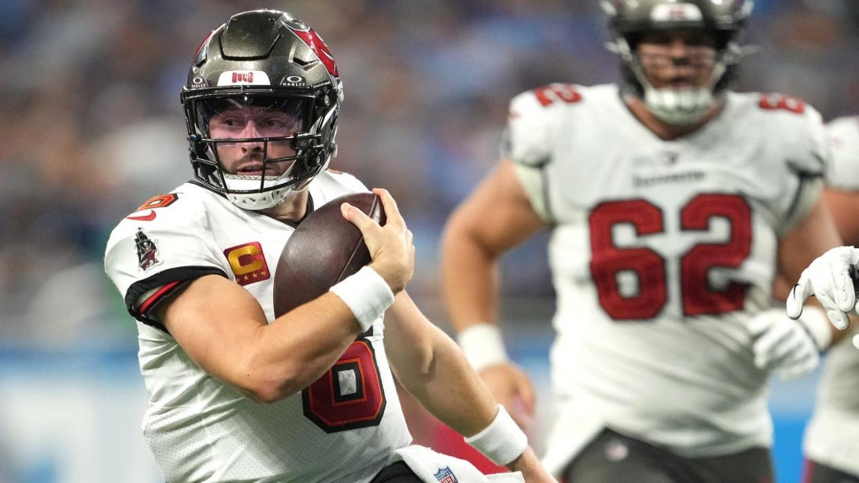 <div>DETROIT, MICHIGAN - SEPTEMBER 15: Quarterback Baker Mayfield #6 of the Tampa Bay Buccaneers runs with the ball against the Detroit Lions during the third quarter at Ford Field on September 15, 2024 in Detroit, Michigan. (Photo by Nic Antaya/Getty Images)</div>