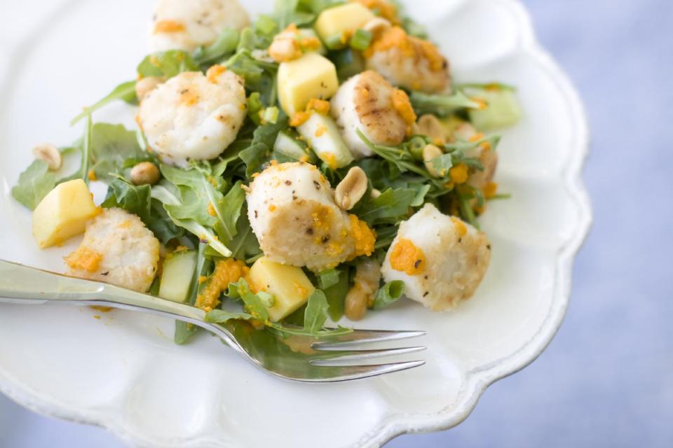 This July 15, 2013 photo shows a warm scallop salad with carrot-ginger dressing in Concord, N.H. (AP Photo/Mathew Mead)