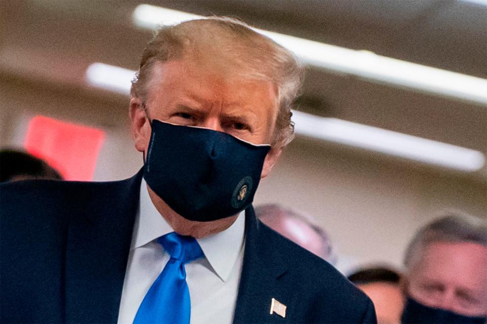 Donald Trump sports a mask on a visit to Walter Reed hospital in Bethesda, Maryland: AFP via Getty Images