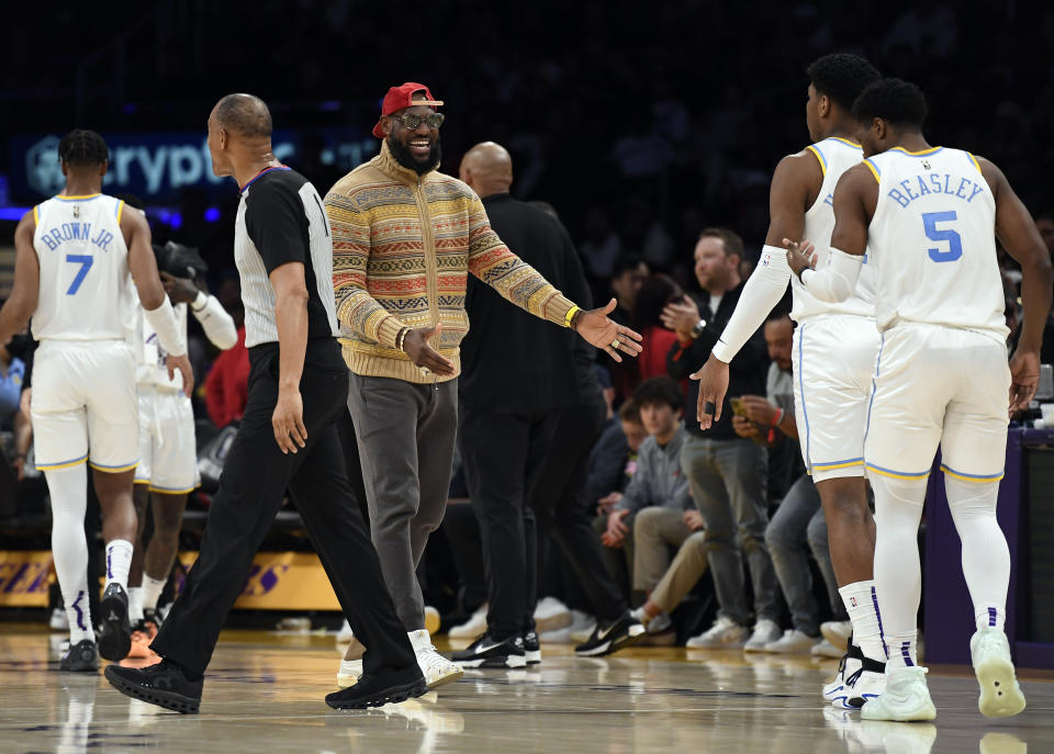 LOS ANGELES, CA - MARCH 12: LeBron James #6 of the Los Angeles Lakers congratulates teammates Malik Beasley #5 and Rui Hachimura #28 during a break in the cation against New York Knicks at Crypto.com Arena on March 12, 2023 in Los Angeles, California. NOTE TO USER: User expressly acknowledges and agrees that, by downloading and or using this photograph, User is consenting to the terms and conditions of the Getty Images License Agreement. (Photo by Kevork Djansezian/Getty Images)