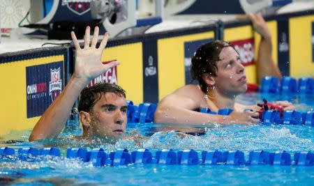 Jun 29, 2016; Omaha, NE, USA; Michael Phelps holds up five fingers during the finals for the men's 200 meter butterfly in the U.S. Olympic swimming team trials at CenturyLink Center. Mandatory Credit: Erich Schlegel-USA TODAY Sports