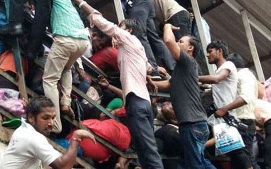 The stampede happened on a footbridge as passengers, who had been taking shelter from heavy rain, tried to leave the station at the same time