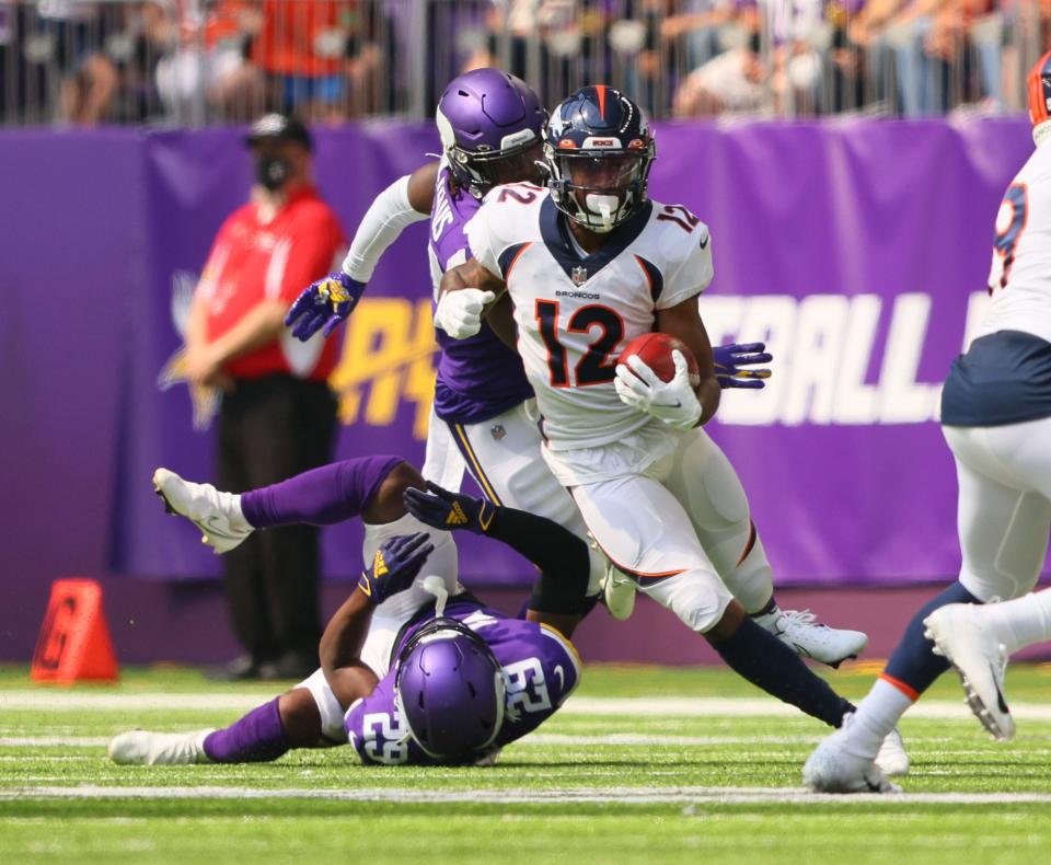 Trinity Benson #12 of the Denver Broncos carries the ball in the first quarter of preseason play against the Minnesota Vikings at U.S. Bank Stadium on Aug. 14, 2021 in Minneapolis.
