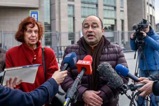 Mine Aydostlu, mother of Turkish novelist Asli Erdogan and Erdogan's lawyer Erdal Dogan speak to the media after the court ruling