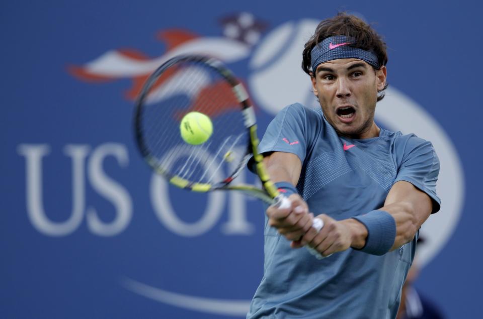 Nadal of Spain hits a return to Djokovic of Serbia in their men's final match at the U.S. Open tennis championships in New York