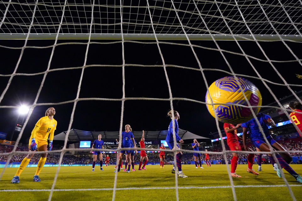 United States goalkeeper Aubrey Kingsbury, left, reacts after giving up a goal to China's Shen Mengyu (9) during the first half of a women's international friendly soccer match, Tuesday, Dec. 5, 2023, in Frisco, Texas. (AP Photo/Julio Cortez)