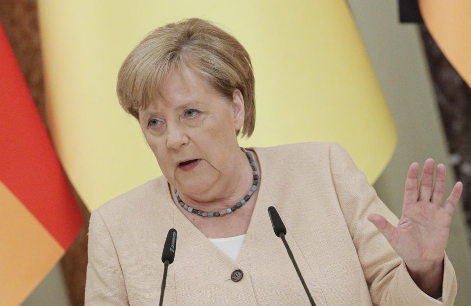 German Chancellor Angela Merkel attends a joint news conference with Ukrainian President Ukrainian President Volodymyr Zelenskyy following their talks at the Mariinsky palace in Kyiv, Ukraine, Sunday, Aug. 22, 2021. German Chancellor Angela Merkel arrived to Kyiv for a working visit to meet with top Ukrainian officials. (Sergey Dolzhenko/Pool Photo via AP)