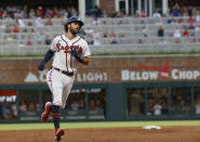 Atlanta Braves' Dansby Swanson runs the bases after hitting a two-run home run against the Los Angeles Dodgers during the third inning of a baseball game Saturday, June 25, 2022, in Atlanta. (AP Photo/Bob Andres)