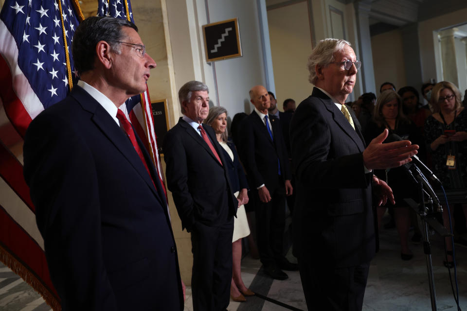 Senate Minority Leader Mitch McConnell (R-Ky.), joined by fellow Senate Republicans, speaking Tuesday. He has said GOP senators are "undecided" on forming a commission to investigate the Capitol riot earlier this year.  (Photo: Kevin Dietsch via Getty Images)