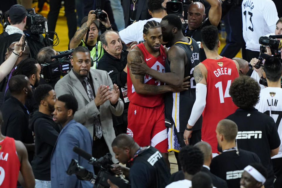 Kawhi Leonard #2 of the Toronto Raptors and Draymond Green #23 of the Golden State Warriors embrace after Game Six of the 2019 NBA Finals at ORACLE Arena on June 13, 2019 in Oakland, California. (Photo by Thearon W. Henderson/Getty Images)