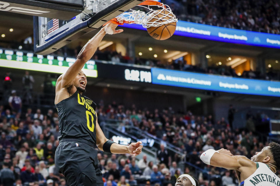 Utah Jazz guard Talen Horton-Tucker (0) dunks during the first half of an NBA basketball game against the Milwaukee Bucks, Friday, March 24, 2023, in Salt Lake City. (AP Photo/Adam Fondren)