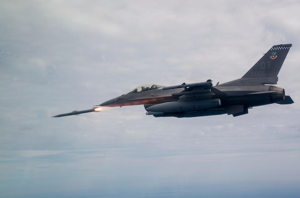 An F-16C Fighting Falcon assigned to the 85th Test Evaluation Squadron shoots an AIM-120 Advanced Medium-Range Air-to-Air Missile, or AMRAAM over testing ranges near Eglin Air Force Base, Fla., March 19, 2019.