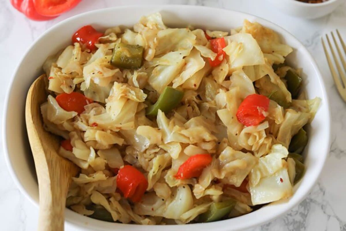 <p>I Can You Can Vegan</p><p>This Fried Cabbage Recipe is the perfect side dish! Savory and easy to make, cooked with red and green bell peppers.</p><p><strong>Get the recipe: <a href="https://www.icanyoucanvegan.com/easy-vegan-fried-cabbage/" rel="nofollow noopener" target="_blank" data-ylk="slk:Easy Vegan Fried Cabbage;elm:context_link;itc:0;sec:content-canvas" class="link rapid-noclick-resp">Easy Vegan Fried Cabbage</a></strong></p>