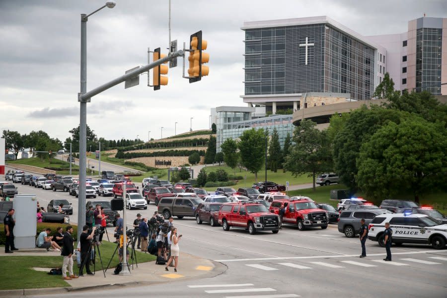 Media gather as Tulsa police and firefighters respond to a shooting at the Natalie Medical Building Wednesday, June 1, 2022. in Tulsa, Okla. Multiple people were shot at a Tulsa medical building on a hospital campus Wednesday. (Ian Maule/Tulsa World via AP)