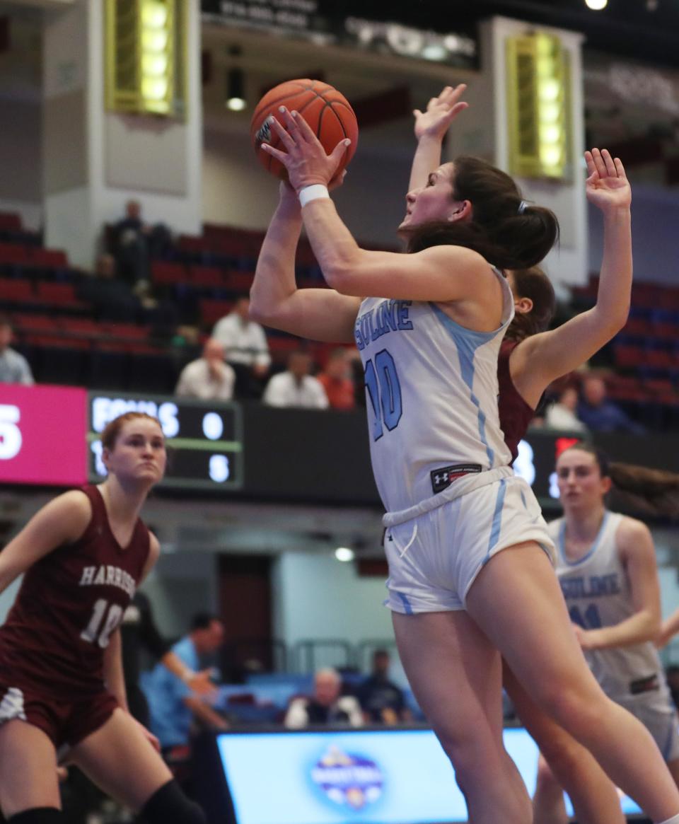 Ursuline's Sophie Nascimento (10) drives to the basket against Harrison during the Section1 Class AA girls basketball semifinal at the Westchester County Center in White Plains Feb. 27, 2024.