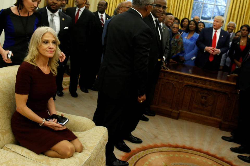 Kellyanne Conway sits on a couch in the Oval Office.