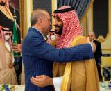 Turkish President Recep Tayyip Erdogan (L) embraces Saudi Crown Prince Mohammed bin Salman during their meeting in Jeddah (AFP/Handout)