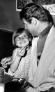 <p>Wide-eyed Dina Burke, 8, whose father donated $1,000 to charity so she could lunch with TV’s Batman, offers The Bat – Adam West – a French fry during lunch at a Hollywood restaurant in Los Angeles, June 28, 1966. Her father, actor Paul Burke, donated the money at a Hollywood charity auction. (Photo/Ellis R. Bosworth/AP) </p>